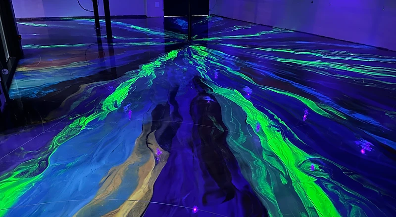 UV-active aurora metallic epoxy pour — electric green concrete coating