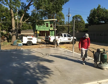 Concrete grinding and floor prep training — residential grinder on a fresh slab with FloorRescue trailer