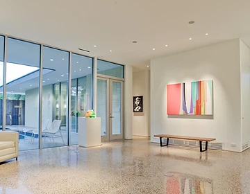 Aggregate polished concrete floor, gallery-style with pool view