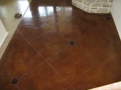 Diamond-pattern scored stained concrete floor — scoring and engraving training