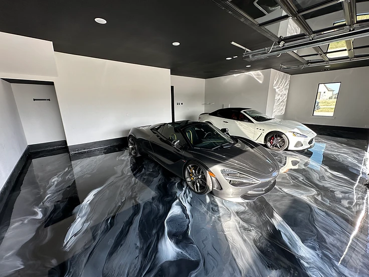 Finished metallic epoxy floor in a luxury garage showcasing the completed metallic design layer