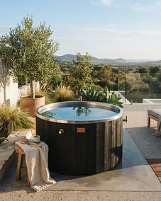 A luxury home cold plunge setup in a serene outdoor patio environment.