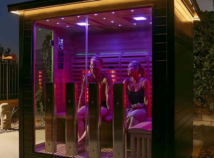 Infrared saunas for restorative warmth at home Modern infrared sauna glowing at twilight with warm ambient lighting