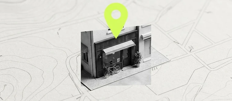 A map with a location pin above a shopfront representing local search