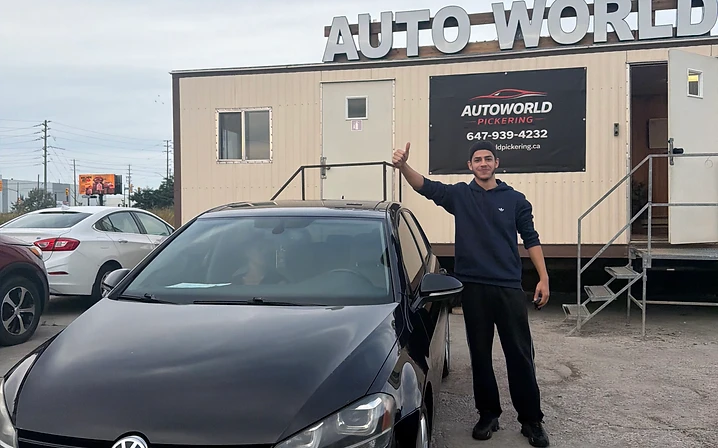 Man with black Volkswagen