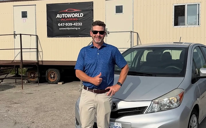 Customer with silver Toyota hatchback