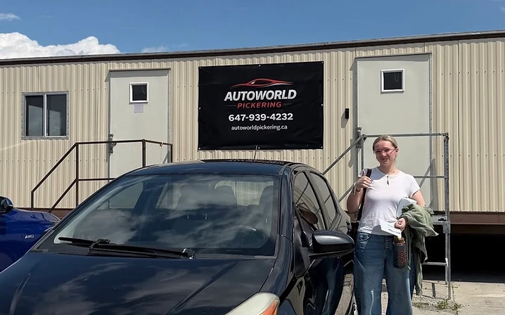 Customer with black Toyota hatchback