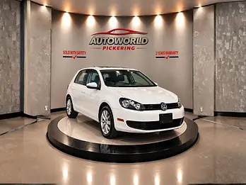 2012 Volkswagen Golf in White on showroom platform