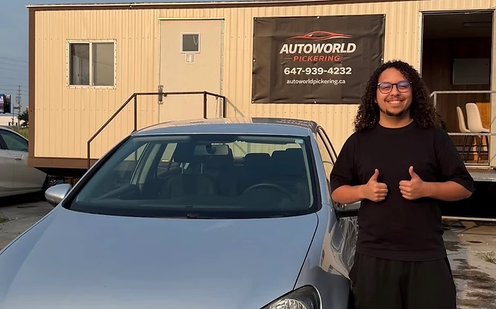 Customer with silver Volkswagen hatchback