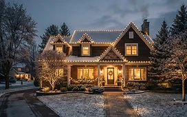 A home with warm white holiday lighting along the roofline, illustrating holiday lighting in Plymouth, Michigan.