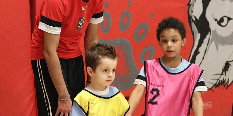 A Revolution Soccer coach working with young players