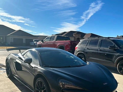 Matte-finish McLaren supercar detailed at the customer's location by mobile service