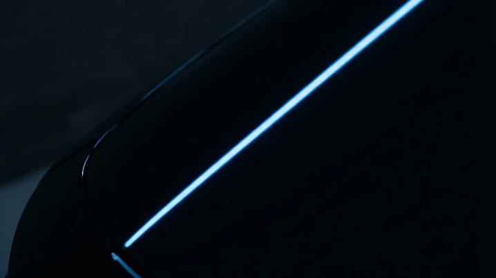 The same vehicle after paint correction with deep, mirror-like gloss and clarity