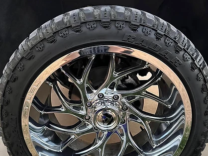 Detailed wheel and tire with a deep gloss finish after full decontamination