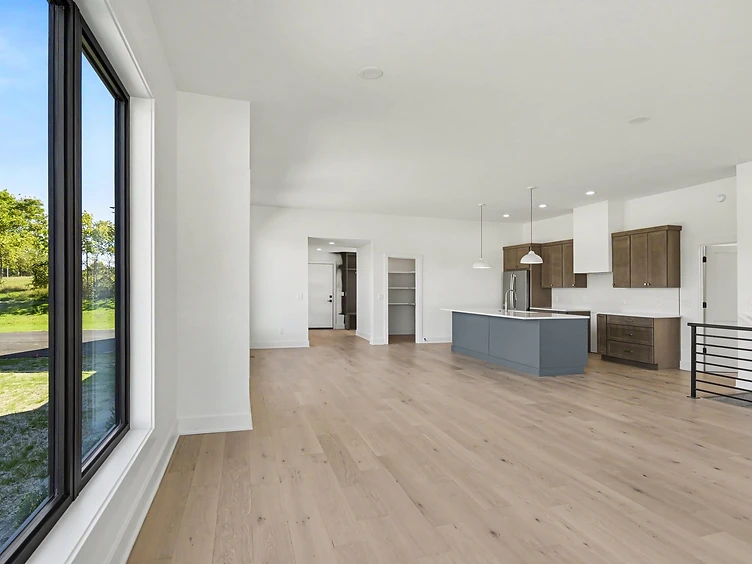 Halmstad open-plan living and kitchen with floor-to-ceiling windows