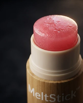 The bamboo stick's pink serum tip melting at high magnification