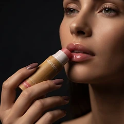 One glide of the stick across the lips