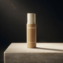 The MeltStick bamboo stick on a dark stone pedestal