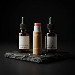 The stick beside amber bottles of its formula oils