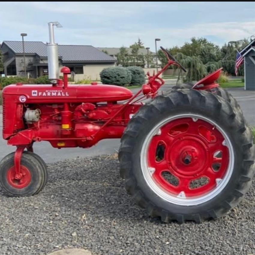A restored red Farmall tractor parked outside in Quincy, Washington
