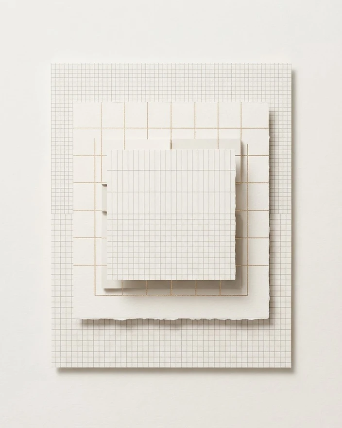 Layered paper grids representing considered website structure and design
