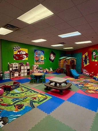 Kid's Room play area with playhouse, slide and rugs