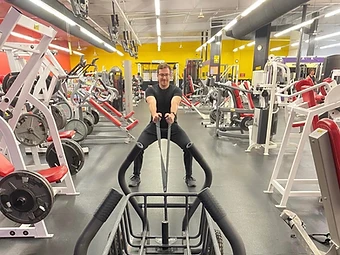Members flexing on the Summit Fitness weight floor