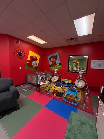Infant area of the Kid's Room with toys and play mats