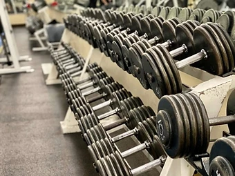 Rows of dumbbells on a rack at Buena Health & Fitness