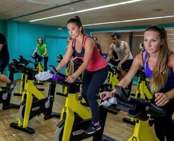 Indoor cycling class sprinting