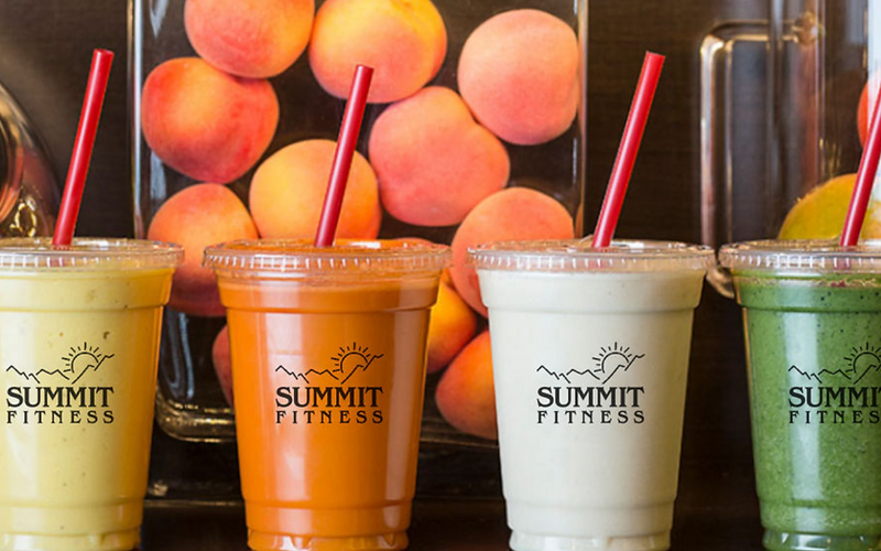 Fresh fruit shakes on a dark counter