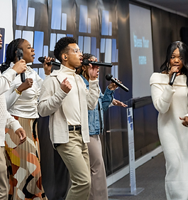 Worship team singing together on stage