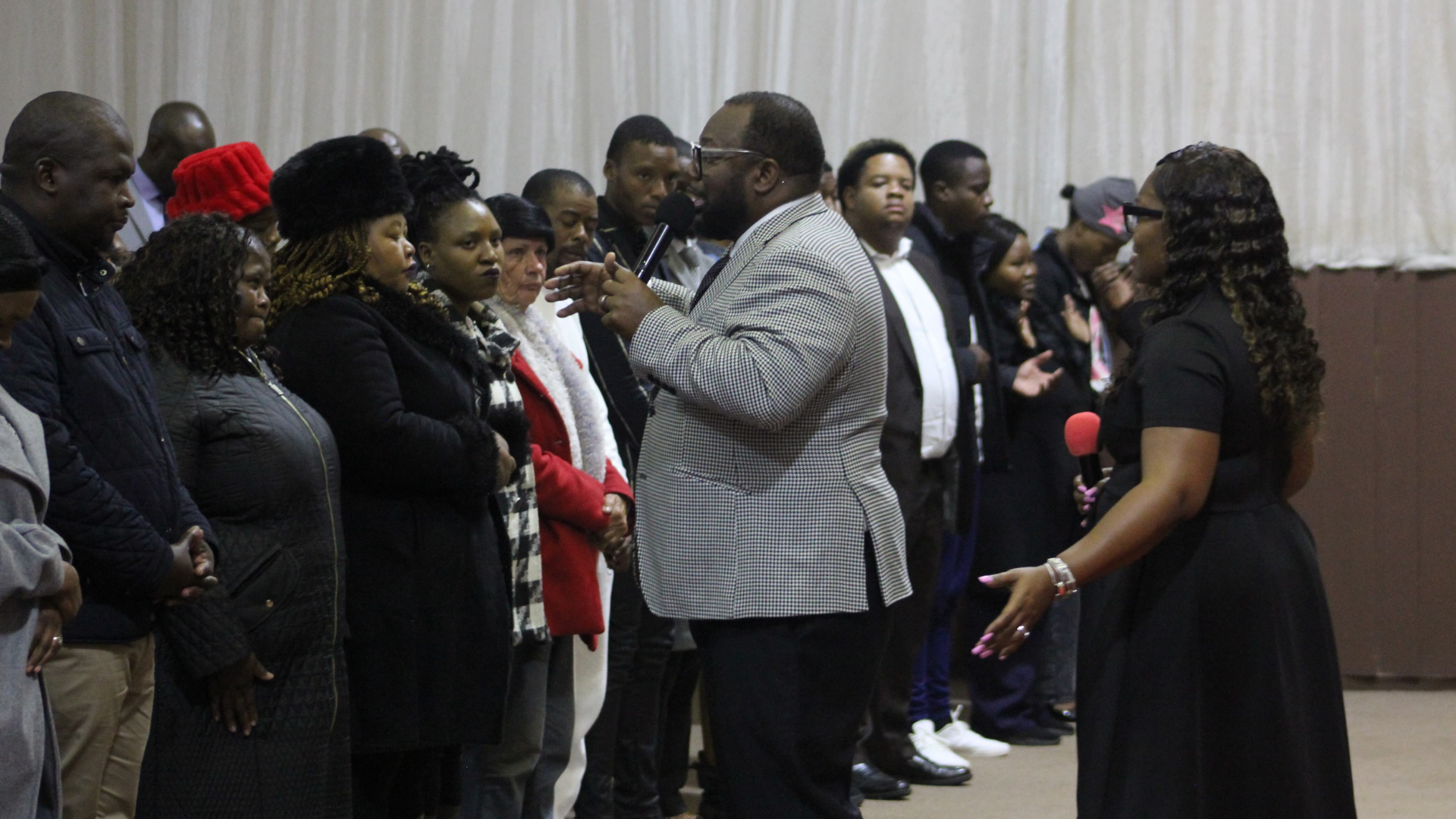 Man speaking to a group at a ministry gathering