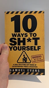 10 Ways to Sh*t Yourself paperback held in hand