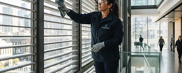 Commercial cleaner cleaning window shutters