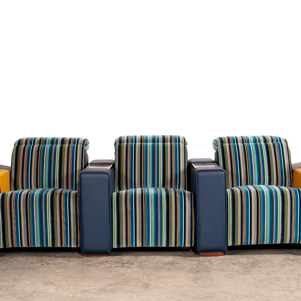 Muse row of three seats — architectural proportions in striped textile and leather