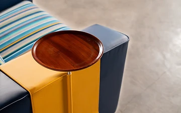 Muse seating detail with a solid timber swivel tray table