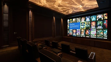 Atelier tiered cinema seating viewed toward the architectural screen wall