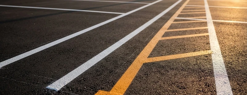 Sealcoated commercial asphalt