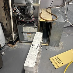 Furnace with a fresh air filter installed during a maintenance visit