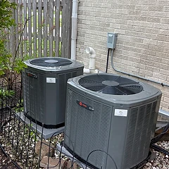 Two Trane XR condensers installed on landscaping gravel