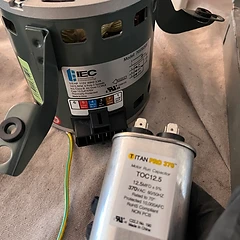 Blower motor and run capacitor replaced during a furnace repair