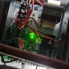 Furnace control board diagnostic LED check during HVAC repair in Des Plaines, IL