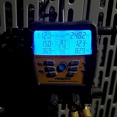 Fieldpiece manifold gauge reading during an AC refrigerant charge check