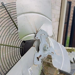 Condenser fan motor assembly repair on an outdoor AC unit
