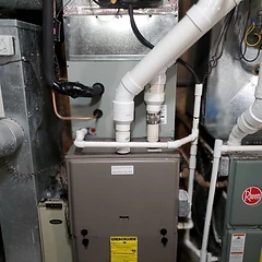 96% AFUE high-efficiency furnace installation in a utility room