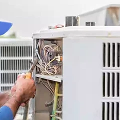 Outdoor condenser control wiring repair by an HVAC technician