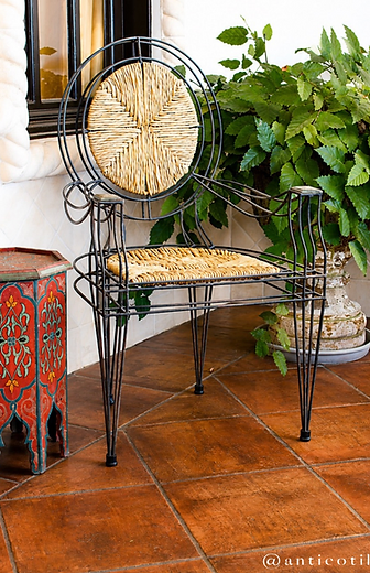 Mediterranean interior with a Saltillo tile floor in golden-hour light