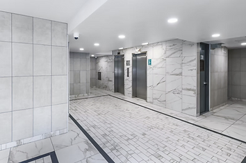 Renovated elevator lobby with new tile and lighting at Berry Street, Williamsburg