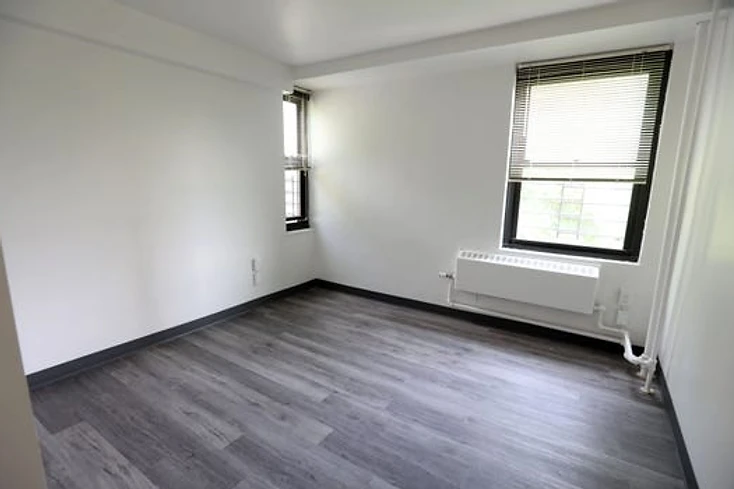 Renovated apartment interior with new plank flooring, Yonkers Preservation